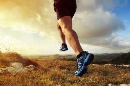 Outdoor cross-country running in early sunrise concept for exerc