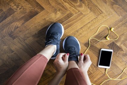 Woman tying shoelace before workout